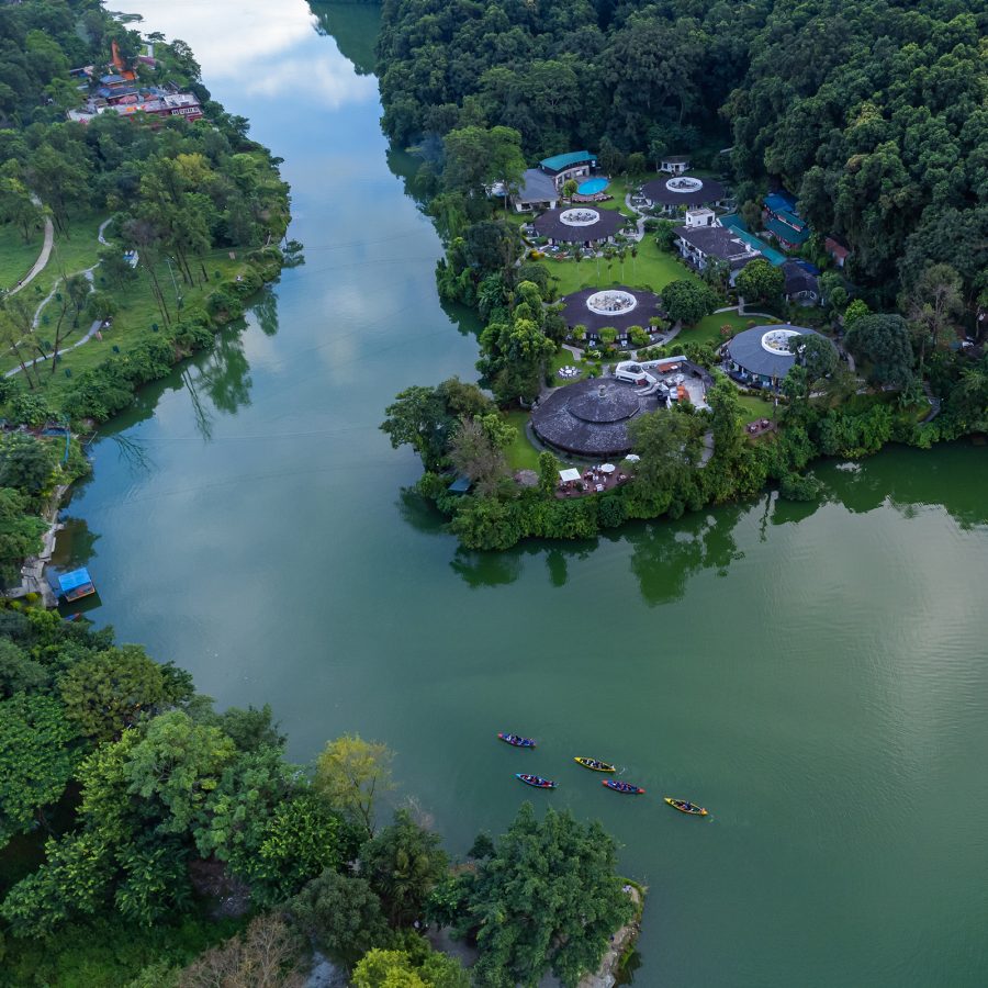 Drone shot of Fish Tail Lodge Pokhara, Nepal, with surrounding river and jungle.
